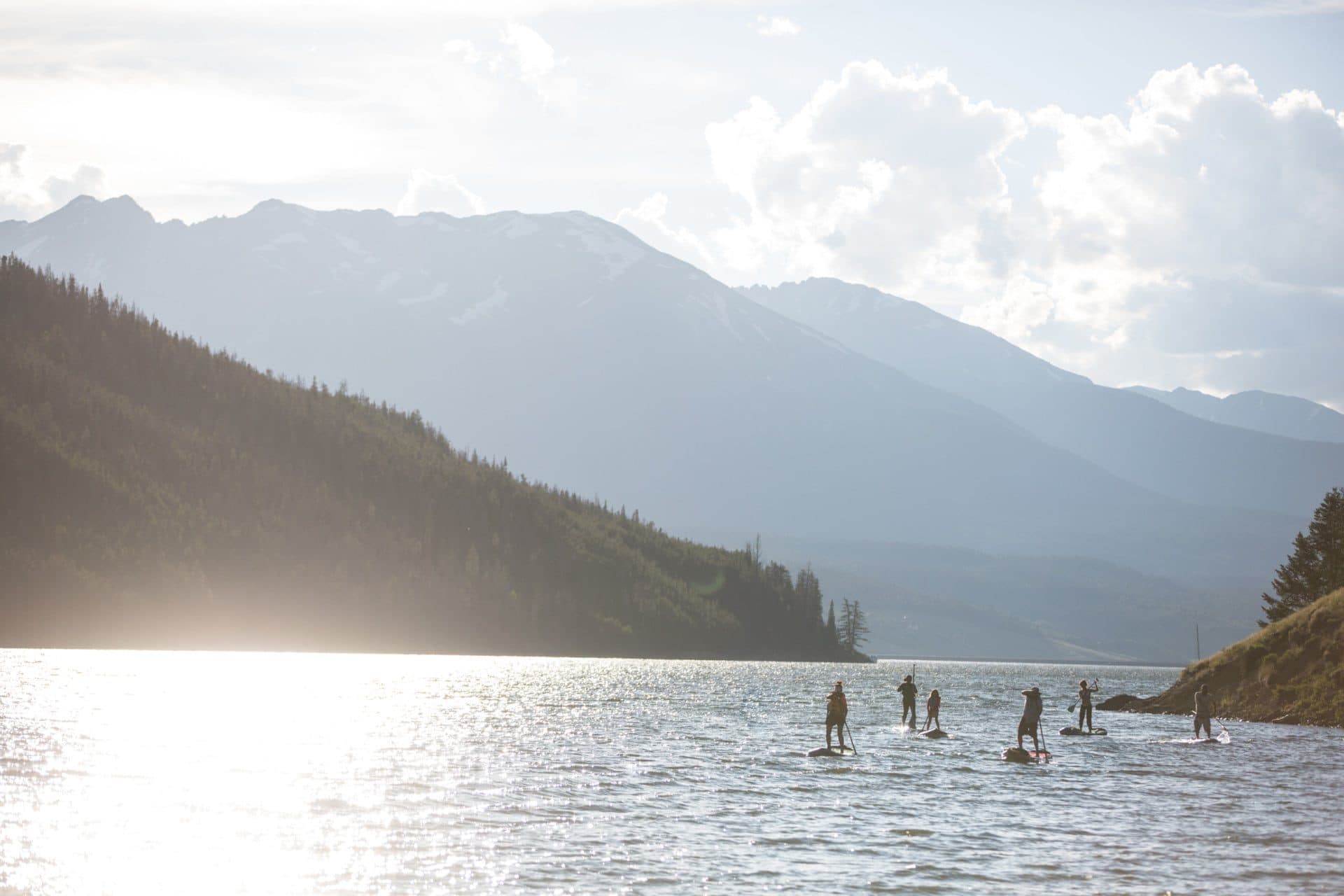 Paddleboarders on Lake Dillon beneath the Colorado Rockies